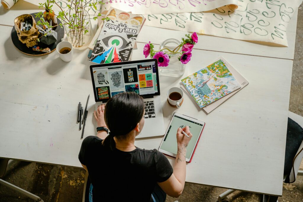 girl drawing on laptop